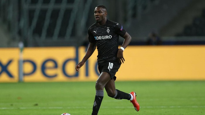 MOENCHENGLADBACH, GERMANY - OCTOBER 27: Marcus Thuram of Moenchengladbach runs with the ball during the UEFA Champions League Group B stage match between Borussia Moenchengladbach and Real Madrid at Borussia-Park on October 27, 2020 in Moenchengladbach, Germany. (Photo by Lars Baron/Getty Images)
