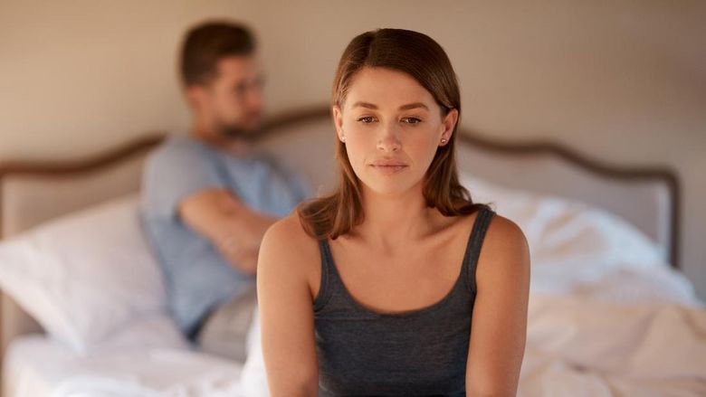 Disloyal boyfriend caught by his angry girlfriend dating with another girl in a restaurant