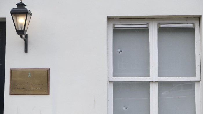 Bullet impacts are seen in the windows of Saudi Arabias embassy in The Hague, Netherlands, Thursday, Nov. 12, 2020, after several shot were fired at the building early in the morning. Nobody was injured and police were investigating. (AP Photo/Mike Corder)