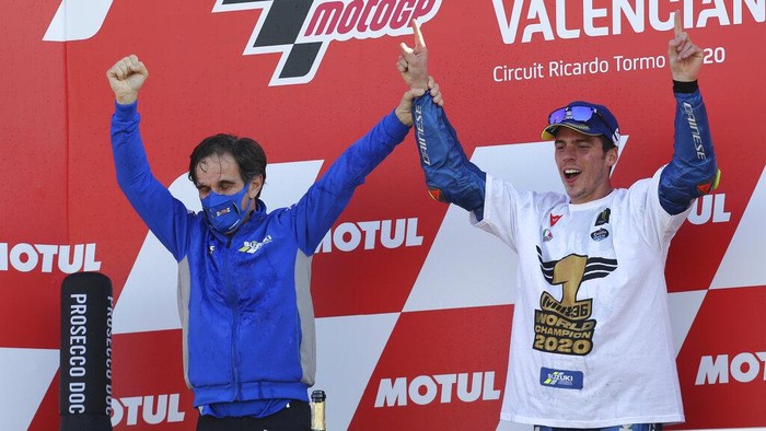 2020 World champion, Spains rider Joan Mir of the Team SUZUKI ECSTAR celebrates with SUZUKI ECSTAR Team Manager Davide Brivio after the end of the MotoGP race during Valencia Grand Prix in Ricardo Tormo Circuit in Valencia, Spain, Sunday, Nov. 15, 2020. (AP Photo/Alberto Saiz)