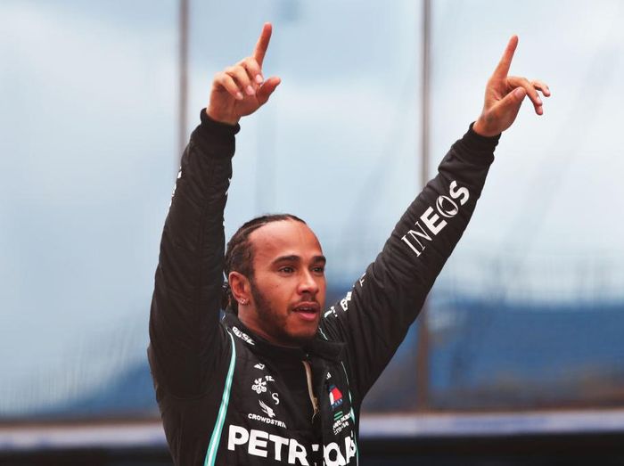 Lewis Hamilton ISTANBUL, TURKEY - NOVEMBER 15: Race winner Lewis Hamilton of Great Britain and Mercedes GP celebrates in parc ferme after winning a 7th F1 World Drivers Championship during the F1 Grand Prix of Turkey at Intercity Istanbul Park on November 15, 2020 in Istanbul, Turkey. (Photo by Tolga Bozoglu - Pool/Getty Images)