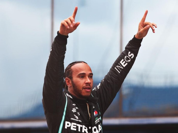 ISTANBUL, TURKEY - NOVEMBER 15: Race winner Lewis Hamilton of Great Britain and Mercedes GP celebrates in parc ferme after winning a 7th F1 World Drivers Championship during the F1 Grand Prix of Turkey at Intercity Istanbul Park on November 15, 2020 in Istanbul, Turkey. (Photo by Tolga Bozoglu - Pool/Getty Images)
