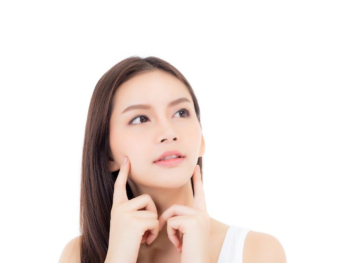 Portrait of beautiful asian woman makeup of cosmetic, girl hand touch cheek and smile attractive, face of beauty perfect with wellness isolated on white background with skin healthcare concept.