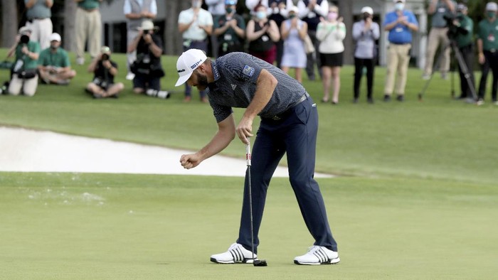 Dustin Johnson reacts after winning the Masters golf tournament Sunday, Nov. 15, 2020, in Augusta, Ga. (Curtis Compton/Atlanta Journal-Constitution via AP)