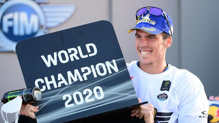 Suzuki Ecstars Spanish rider Joan Mir celebrates after winning the MotoGP world championship after the Valencia Grand Prix at the Ricardo Tormo circuit in Valencia on November 15, 2020. (Photo by LLUIS GENE / AFP)