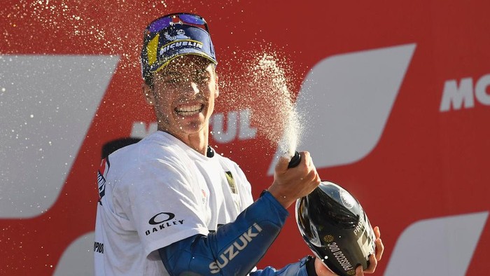 VALENCIA, SPAIN - NOVEMBER 15: Joan Mir of Spain and Team Suzuki ECSTAR  celebrates with champagne the victory of 2020 championship of MotoGp season  on the podium at the end of the MotoGp race during the MotoGP of Comunitat Valenciana at Comunitat Valenciana Ricardo Tormo Circuit on November 15, 2020 in Valencia, Spain. (Photo by Mirco Lazzari gp/Getty Images)