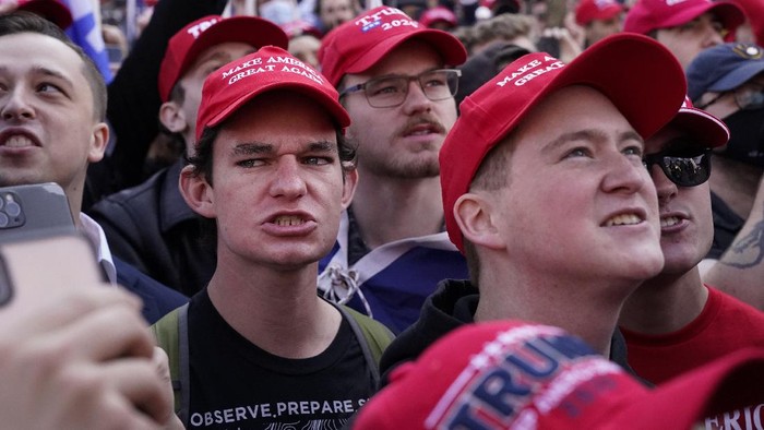 Supporters of President Donald Trump listen to a speaker during a pro-Trump march Saturday Nov. 14, 2020, in Washington. (AP Photo/Jacquelyn Martin)