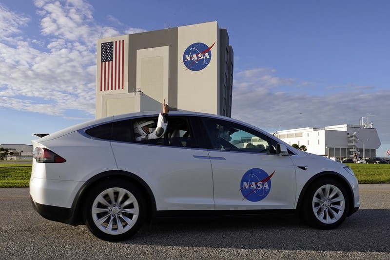 The countdown clock is stopped at a three-hour built in hold as a SpaceX Falcon 9 rocket, with the company's Crew Dragon capsule attached, sits on the launch pad at Launch Complex 39A Sunday, Nov. 15, 2020, at the Kennedy Space Center in Cape Canaveral, Fla. Four astronauts will fly on the SpaceX Crew-1 mission to the International Space Station scheduled for launch on later today. (AP Photo/Chris O'Meara)