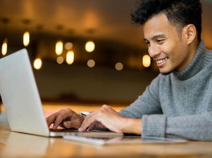1060090732 close up businessman typing on keyboard laptop at loft office for search data information and knowledge on web browser concept