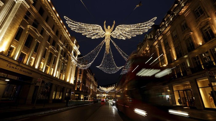The Regent Street Christmas lights entitled 'The Spirit of Christmas' stand illuminated after being switched on yesterday without a ceremony as shops on the street lie temporarily closed due to England's second coronavirus lockdown, in London, Sunday, Nov. 15, 2020. This week saw Britain on Wednesday become the fifth country in the world to record more than 50,000 coronavirus-related deaths and on Thursday to record 33,470 people testing positive for COVID-19, the highest daily number of new cases since the virus first struck. (AP Photo/Matt Dunham)