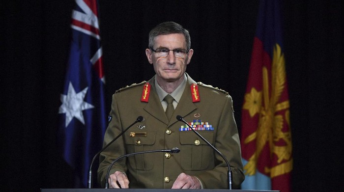 Chief of the Australian Defence Force Gen. Angus Campbell delivers the findings from the Inspector-General of the Australian Defence Force Afghanistan Inquiry, in Canberra, Thursday, Nov. 19, 2020. A shocking report into war crimes by elite Australian troops has found evidence that 25 soldiers unlawfully killed 39 Afghan prisoners, farmers and civilians. (Mick Tsikas/Pool Photo via AP)