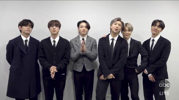 In this screen shot provided by ABC on Sunday, Nov. 22, 2020, BTS accepts the award for favorite pop/rock duo or group at the American Music Awards at the Microsoft Theater in Los Angeles. (ABC via AP)