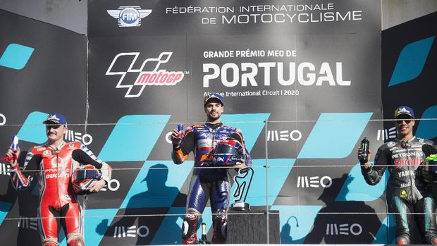 PORTIMAO, PORTUGAL - NOVEMBER 22: (L-R) Jack Miller of Australia and Pramac Racing,  Miguel Oliveira of Portugal and Team KTM Tech 3 and Franco Morbidelli of Italy and Petronas Yamaha SRT celebrate on the podium at the end of the MotoGp race during the MotoGP of Portugal at Algarve Motor Park on November 22, 2020 in Portimao, Portugal. (Photo by Mirco Lazzari gp/Getty Images)