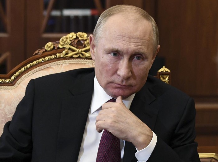 Russian President Vladimir Putin listens during a meeting in the Kremlin, in Moscow, Russia, Thursday, Nov. 19, 2020. (Alexei Nikolsky, Sputnik, Kremlin Pool Photo via AP)