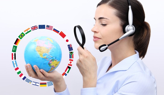 concept search, customer service operator woman with headset, globe, flags and magnifying glass