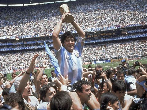 FILE - In this June 29, 1986 file photo, Diego Maradona holds up his team's trophy after Argentina's 3-2 victory over West Germany at the World Cup final soccer match at Atzeca Stadium in Mexico City. The Argentine soccer great who was among the best players ever and who led his country to the 1986 World Cup title before later struggling with cocaine use and obesity, died from a heart attack on Wednesday, Nov. 25, 2020, at his home in Buenos Aires. He was 60. (AP Photo/Carlo Fumagalli, File)