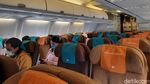 Suasana Terbang Naik Garuda Indonesia Dilengkapi Protokol Kesehatan