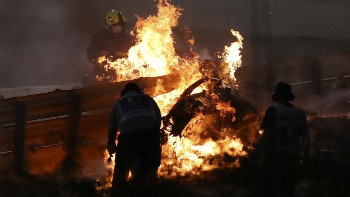 The parts of Haas driver Romain Grosjeans car is burning after he crashed during the Formula One race in Bahrain International Circuit in Sakhir, Bahrain, Sunday, Nov. 29, 2020. (Brynn Lennon, Pool via AP)