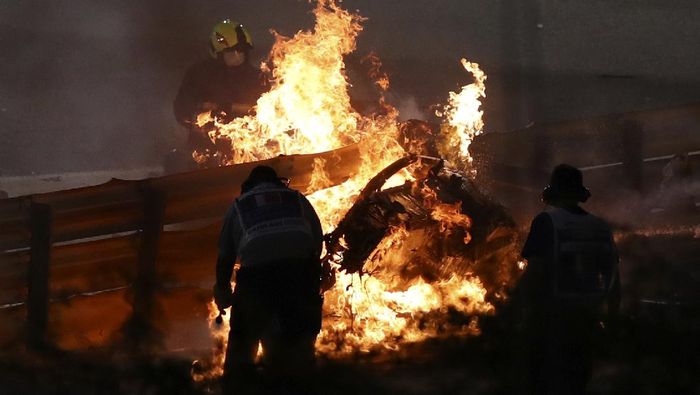 Romain Grosjean The parts of Haas driver Romain Grosjeans car is burning after he crashed during the Formula One race in Bahrain International Circuit in Sakhir, Bahrain, Sunday, Nov. 29, 2020. (Brynn Lennon, Pool via AP)