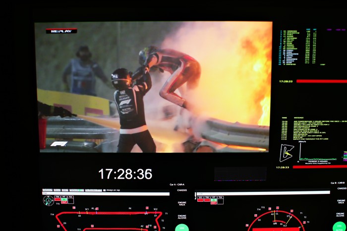 BAHRAIN, BAHRAIN - NOVEMBER 29: Romain Grosjean of France and Haas F1 is pictured on a screen escaping his crash during the F1 Grand Prix of Bahrain at Bahrain International Circuit on November 29, 2020 in Bahrain, Bahrain. (Photo by Peter Fox/Getty Images)
