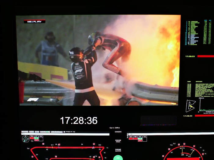 BAHRAIN, BAHRAIN - NOVEMBER 29: Romain Grosjean of France and Haas F1 is pictured on a screen escaping his crash during the F1 Grand Prix of Bahrain at Bahrain International Circuit on November 29, 2020 in Bahrain, Bahrain. (Photo by Peter Fox/Getty Images)