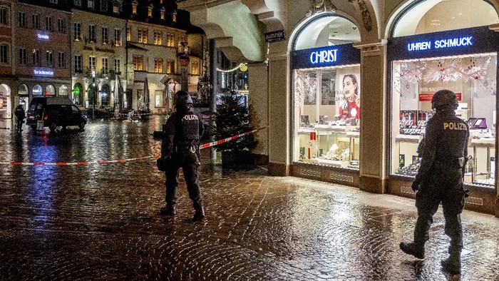 A square is blocked by the police in Trier, Germany, Tuesday, Dec. 1, 2020.  German police say two people have been killed and several others injured in the southwestern German city of Trier when a car drove into a pedestrian zone. Trier police tweeted that the driver had been arrested and the vehicle impounded. (Harald Tittel/dpa via AP)