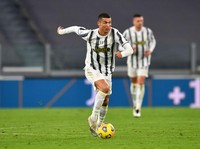 TURIN, ITALY - NOVEMBER 21: Cristiano Ronaldo of Juventus runs with the ball during the Serie A match between Juventus and Cagliari Calcio at  on November 21, 2020 in Turin, Italy. Football Stadiums around Europe remain empty due to the Coronavirus Pandemic as Government social distancing laws prohibit fans inside venues resulting in fixtures being played behind closed doors. (Photo by Valerio Pennicino/Getty Images)