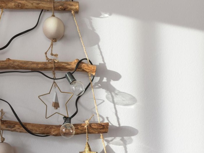 2020 New Year Alternative Christmas trees homemade cookies Christmas-tree decorations-balls lying on a blue background. Close-up, horizontal layout, copy space.