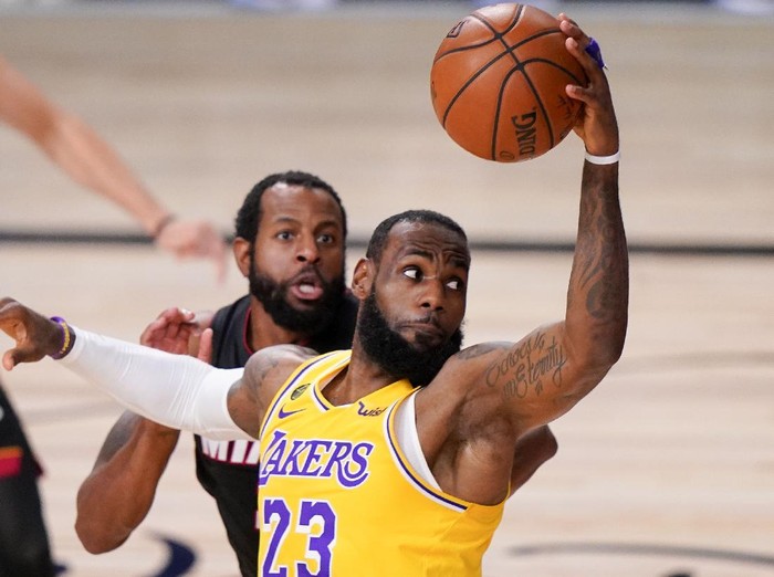 FILE - In this Tuesday, Oct. 6, 2020 file photo, Los Angeles Lakers forward LeBron James drives to the basket against the Miami Heat during the first half in Game 4 of basketballs NBA Finals in Lake Buena Vista, Fla. LeBron James has agreed to a contract extension with the Los Angeles Lakers. James agency, Klutch Sports, confirmed the deal Wednesday, Dec. 2, 2020 during the first week of training camp for the NBA champions. (AP Photo/Mark J. Terrill, File)