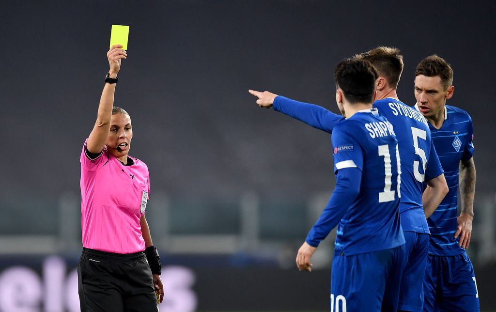 TURIN, ITALY - DECEMBER 02: Match Referee, Stephanie Frappart shows a yellow card during the UEFA Champions League Group G stage match between Juventus and Dynamo Kyiv at Allianz Stadium on December 02, 2020 in Turin, Italy. Sporting stadiums around Italy remain under strict restrictions due to the Coronavirus Pandemic as Government social distancing laws prohibit fans inside venues resulting in games being played behind closed doors. (Photo by Valerio Pennicino/Getty Images)