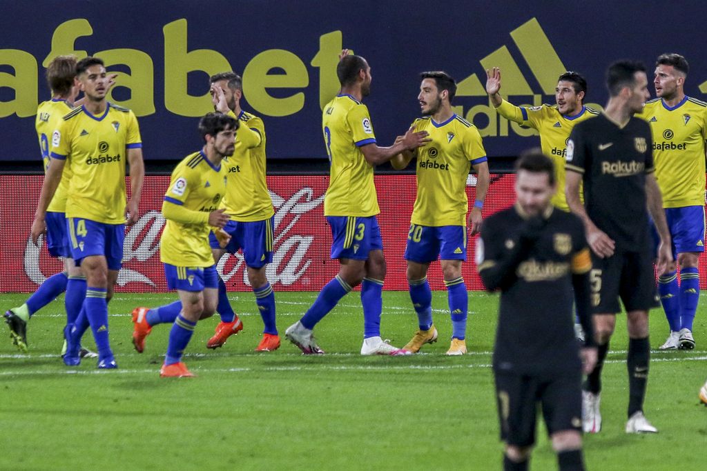 Cadiz players celebrate their opening goal during the Spanish La Liga soccer match between Cadiz and FC Barcelona at the Ramon Carranza stadium in Cadiz, Spain, Saturday Dec. 5, 2020. (AP Photo/Alvaro Rivero)