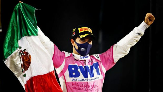BAHRAIN, BAHRAIN - DECEMBER 06: Race winner Sergio Perez of Mexico and Racing Point celebrates in parc ferme during the F1 Grand Prix of Sakhir at Bahrain International Circuit on December 06, 2020 in Bahrain, Bahrain. (Photo by Mark Thompson/Getty Images)