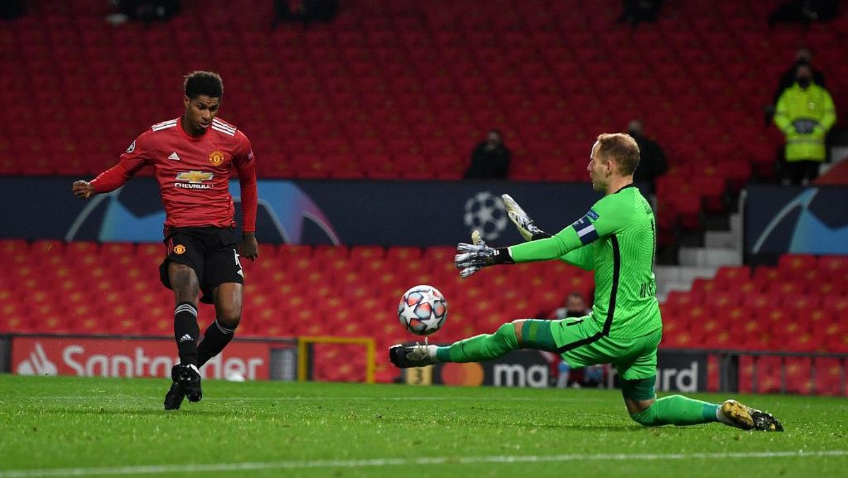 RB Leipzig vs MU: Marcus Rashford menatap torehan manis. (Foto: AFP/ANTHONY DEVLIN)