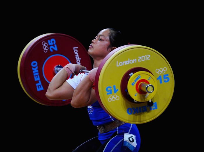LONDON, ENGLAND - JULY 29:  Citra Febrianti of Indonesia competes in the Womens 53kg Weightlifting on Day 2 of the London 2012 Olympic Games at ExCeL on July 29, 2012 in London, England.  (Photo by Laurence Griffiths/Getty Images)