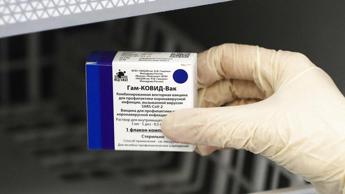 A medical worker moves a box of Russias Sputnik V coronavirus vaccine out from a refrigerator prior to administering a vaccination in Moscow, Russia, Saturday, Dec. 5, 2020. Thousands of doctors, teachers and others in high-risk groups have signed up for COVID-19 vaccinations in Moscow starting Saturday, a precursor to a sweeping Russia-wide immunization effort. (AP Photo/Pavel Golovkin)