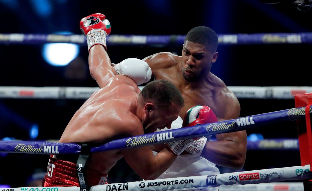 LONDON, ENGLAND - DECEMBER 12: Anthony Joshua punches Kubrat Pulev during the IBF, WBA, WBO and IBO World Heayweight Title fight between Anthony Joshua and Kubrat Pulev at The SSE Arena, Wembley on December 12, 2020 in London, England. A limited number of fans (1000) are welcomed back to sporting venues to watch elite sport across England. This was following easing of restrictions on spectators in tiers one and two areas only. (Photo by Andrew Couldridge - Pool/Getty Images)