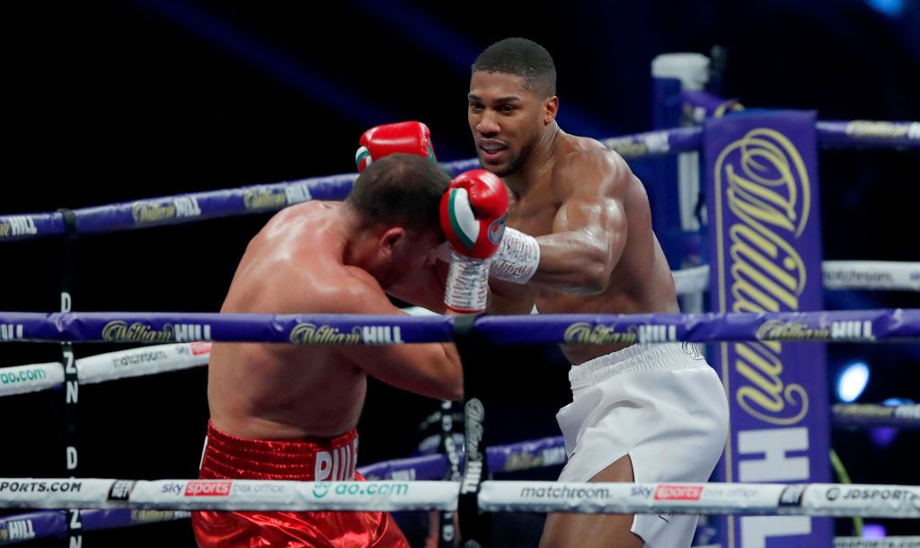 LONDON, ENGLAND - DECEMBER 12: Anthony Joshua punches Kubrat Pulev during the IBF, WBA, WBO and IBO World Heayweight Title fight between Anthony Joshua and Kubrat Pulev at The SSE Arena, Wembley on December 12, 2020 in London, England. A limited number of fans (1000) are welcomed back to sporting venues to watch elite sport across England. This was following easing of restrictions on spectators in tiers one and two areas only. (Photo by Andrew Couldridge - Pool/Getty Images)