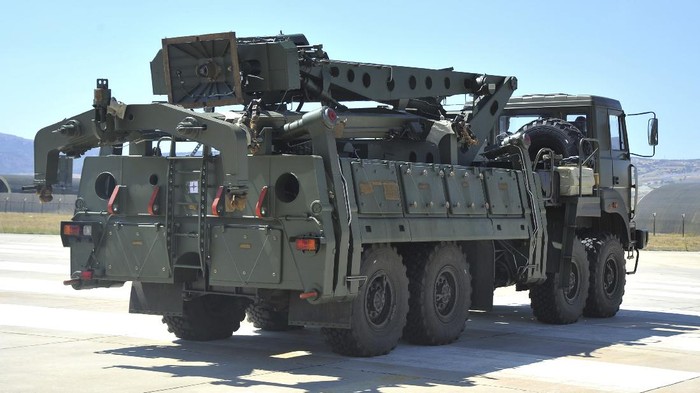 FILE - In this Tuesday, Aug. 27, 2019 file photo, a truck carrying parts of the S-400 air defense systems, exits a Russian transport aircraft after landing at Murted military airport outside Ankara, Turkey.  The Trump administration is imposing sanctions on its NATO ally Turkey over its purchase of a Russian air defense system. The move comes at a delicate time in relations between Washington and Ankara. The countries have been at odds over Turkeys acquisition from Russia of the S-400 missile defense system.  (Turkish Defence Ministry via AP, Pool, File)