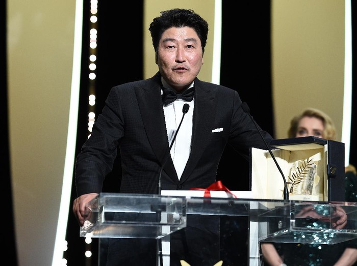 CANNES, FRANCE - MAY 25: Kang-Ho Song speaks after receiving the Palme dOr award for Parasite at the Closing Ceremony during the 72nd annual Cannes Film Festival on May 25, 2019 in Cannes, France. (Photo by Pascal Le Segretain/Getty Images)