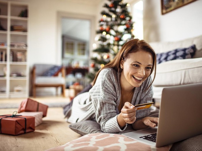 Close up of a young woman buying presents online