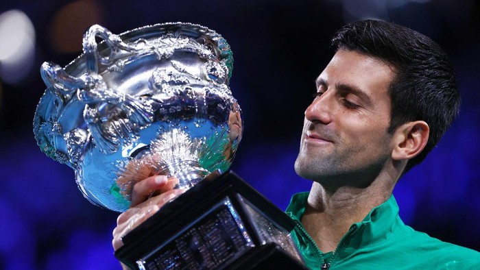 MELBOURNE, AUSTRALIA - FEBRUARY 02: Novak Djokovic of Serbia poses with the Norman Brookes Challenge Cup after winning the Mens Singles Final against Dominic Thiem of Austria on day fourteen of the 2020 Australian Open at Melbourne Park on February 02, 2020 in Melbourne, Australia. (Photo by Cameron Spencer/Getty Images)