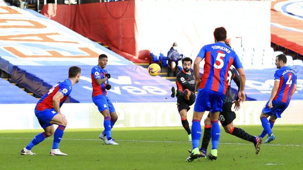 Liverpool's Mohamed Salah, centre, scores his side's seventh goal during the English Premier League soccer match between Crystal Palace and Liverpool at Selhurst Park stadium in London, Saturday, Dec. 19, 2020. (Adam Davy/Pool via AP)