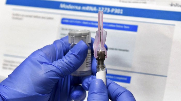 FILE - In this July 27, 2020, file photo, a nurse prepares a shot as a study of a possible COVID-19 vaccine, developed by the National Institutes of Health and Moderna Inc., gets underway in Binghamton, N.Y. The U.S. is poised to give the green light as early as Friday, Dec. 18, to a second COVID-19 vaccine, a critical new weapon against the surging coronavirus. Doses of the vaccine developed by Moderna Inc. and the National Institutes of Health will give a much-needed boost to supplies as the biggest vaccination effort in the nation’s history continues. (AP Photo/Hans Pennink, File)