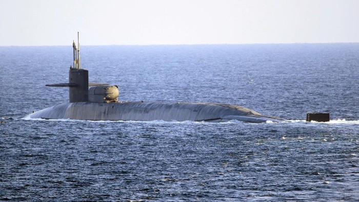 In this photo made available by the U.S. Navy, the guided-missile submarine USS Georgia transits the Strait of Hormuz in Persian Gulf, Monday, Dec. 21, 2020. The USS Georgia traversed the strategically vital waterway between Iran and the Arabian Peninsula on Monday, the U.S. Navy said, a rare announcement that comes amid rising tensions with Iran. (Mass Communication Specialist 2nd Class Indra Beaufort/U.S. Navy via AP)
