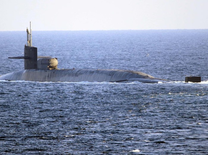 In this photo made available by the U.S. Navy, the guided-missile submarine USS Georgia transits the Strait of Hormuz in Persian Gulf, Monday, Dec. 21, 2020. The USS Georgia traversed the strategically vital waterway between Iran and the Arabian Peninsula on Monday, the U.S. Navy said, a rare announcement that comes amid rising tensions with Iran. (Mass Communication Specialist 2nd Class Indra Beaufort/U.S. Navy via AP)