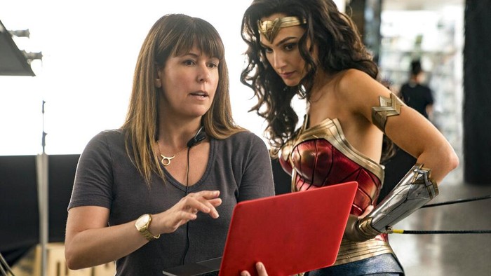 This image released by Warner Bros. Entertainment shows director Patty Jenkins, left, with actress Gal Gadot on the set of Wonder Woman 1984. (Clay Enos/Warner Bros. Entertainment via AP)