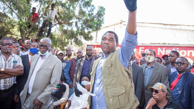 Hakainde Hichilema, leader of the United Party for National Development (UPND), gestures as he addresses supporters after being questioned at Lusaka Police Force headquarters in Lusaka, Zambia, on December 23, 2020. - Two demonstrators were killed on December 23, 2020 in a protest outside the police headquarters in the Zambian capital Lusaka, where opposition leader Hakainde Hichilema was being questioned. (Photo by SALIM DAWOOD / AFP)