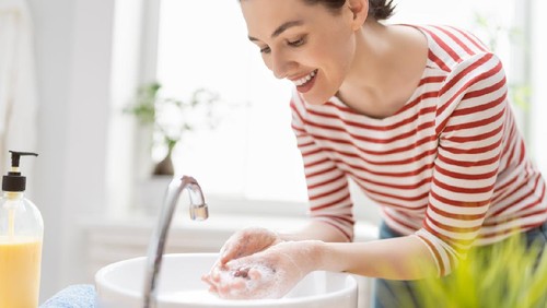 Person is washing hands rubbing with soap. Protection against coronavirus. Prevention, hygiene to stop spreading virus.