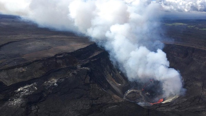 A plume rises near active fissures in the crater of Hawaiis Kilauea volcano on Monday, Dec. 21, 2020. People are lining up to try to get a look at the volcano on the Big Island, which erupted last night and spewed ash and steam into the atmosphere. A spokeswoman for Hawaii Volcanoes National Park says the volcanic activity is a risk to people in the park Monday and that caution is needed. (M. Patrick/U.S. Geological Survey via AP)