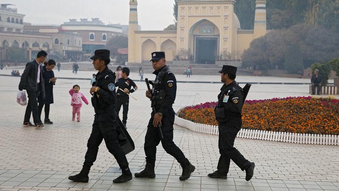 Virus Outbreak China Residents line up for coronavirus tests at tents set up on the streets of Beijing on Sunday, Dec. 27, 2020. Beijing has urged residents not to leave the city during the Lunar New Year holiday in February, implementing new restrictions and mass testings after several coronavirus infections last week. (AP Photo/Ng Han Guan)